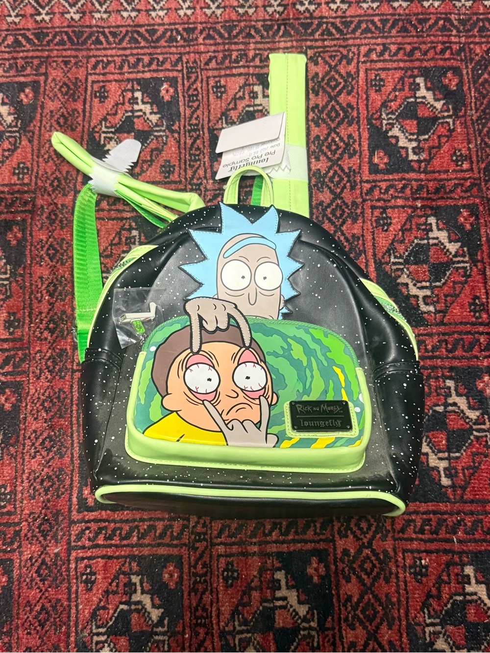 Loungefly Black Mini Backpack with Neon Green Trim and Cartoon Patch